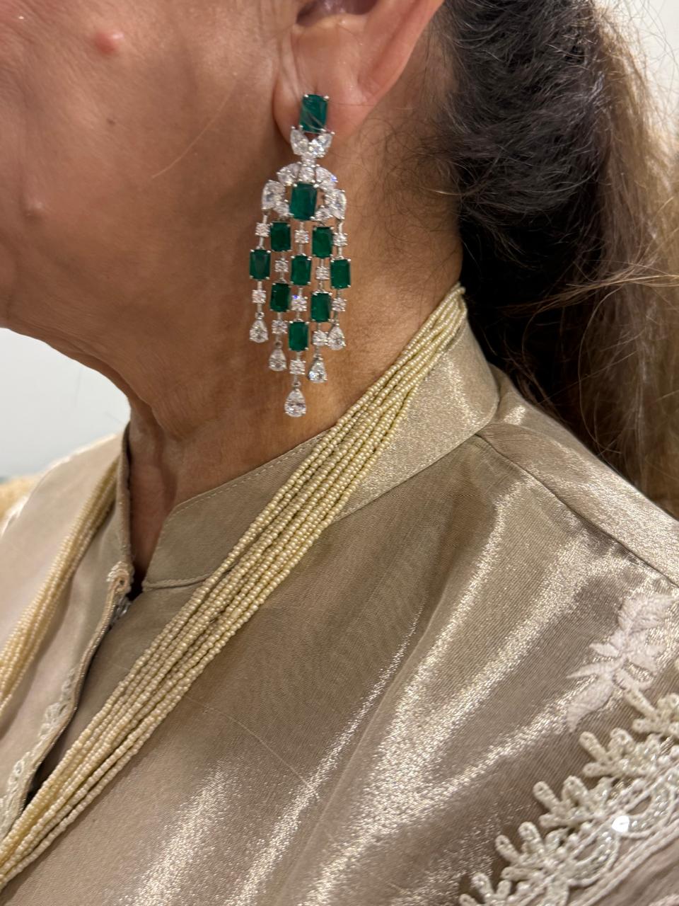 The Queen’ long stringy Victorian earrings